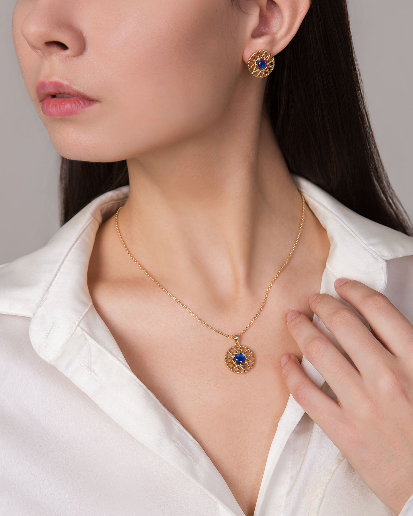 amoare twelve heart gold plated silver jewellery set of small pendant and earrings with sapphire color zirconias