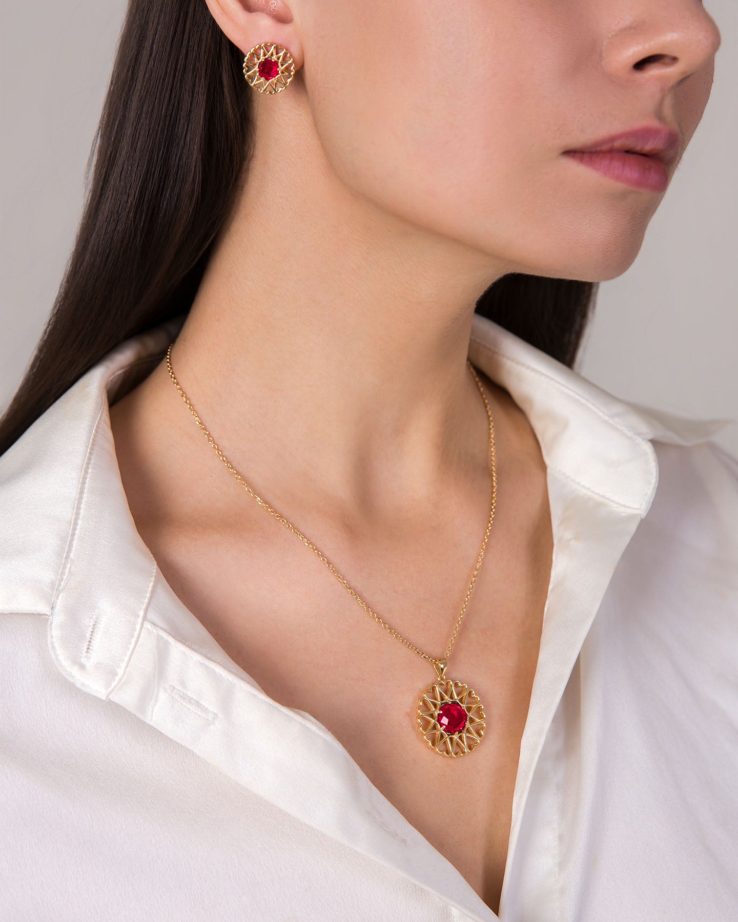 amoare twelve heart gold plated silver jewellery set of large pendant and earrings with ruby color zirconias