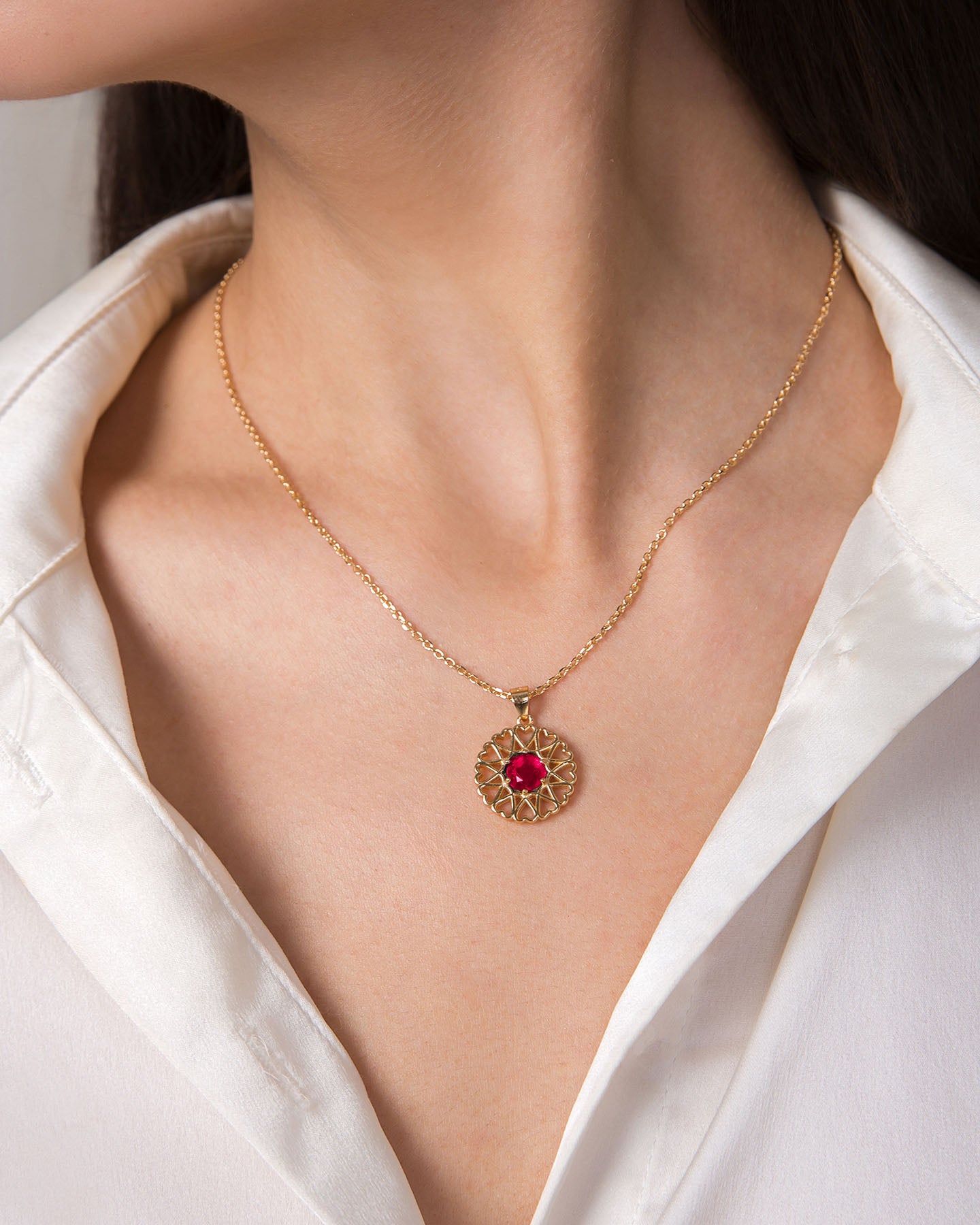 amoare twelve heart small gold plated silver pendant with ruby color zirconia