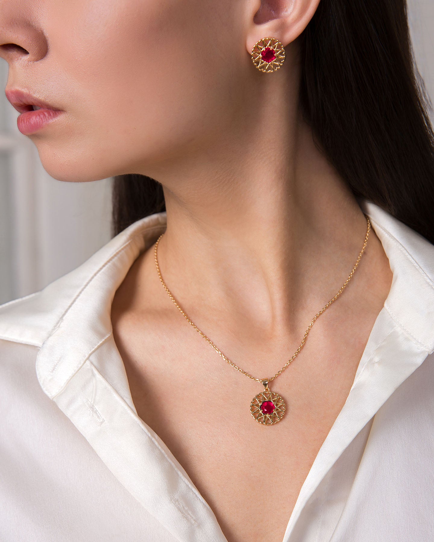amoare twelve heart gold plated silver jewellery set of small pendant and earrings with ruby color zirconias