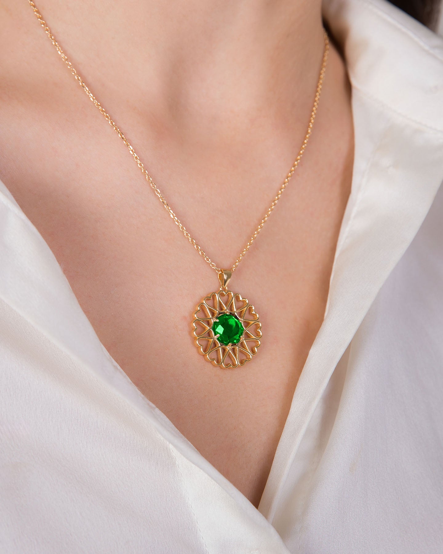 amoare twelve heart large gold plated silver pendant with emerald color zirconia